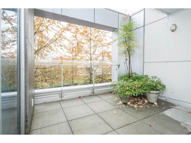 Bright sunroom with large glass doors, autumn foliage view, tiled floor. - TH17 - 1233 West Cordova St, Vancouver Downtown