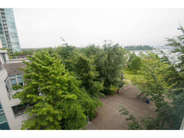 Bright living room with city view and lush greenery. - TH17 - 1233 West Cordova St, Vancouver Downtown