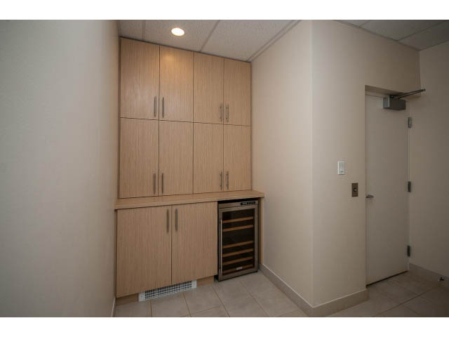 Bright kitchen with wooden cabinets and built-in wine fridge. - TH17 - 1233 West Cordova St, Vancouver Downtown