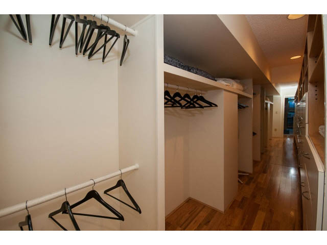 Spacious walk-in closet with wooden floors and hanging hangers. - 5338 Montiverdi Pl, West Vancouver