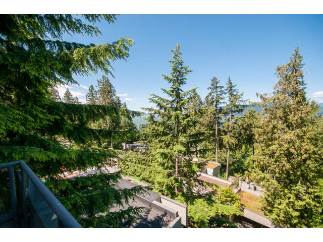 Bright living room with a stunning view of the mountains and trees. - 5338 Montiverdi Pl, West Vancouver