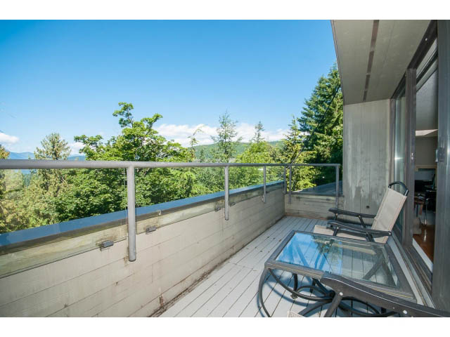 Furnished balcony with glass railings and a view of greenery. - 5338 Montiverdi Pl, West Vancouver