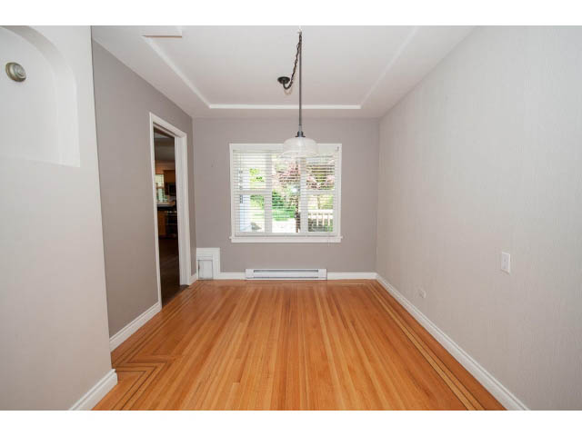 Bright living room with hardwood floors and large windows. - 3626 Loraine Ave, North Vancouver