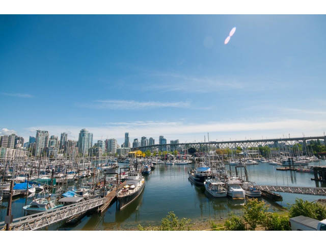 Bright balcony with stunning city view and marina, perfect for waterfront living. - 307 - 1490 Pennyfarthing Drive, Vancouver West Side