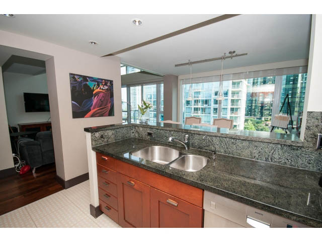 Bright kitchen with granite countertops, hardwood floors, and a city view. - 803 - 590 Nicola Street, Vancouver Downtown