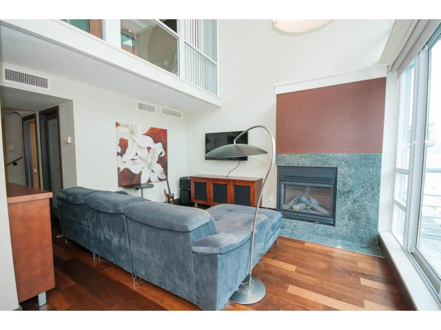 Bright living room with hardwood floors, modern furniture, and city view. - 803 - 590 Nicola Street, Vancouver Downtown