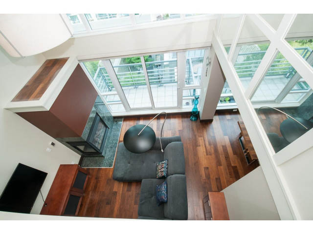 Furnished loft with hardwood floors, large windows, and a city view. - 803 - 590 Nicola Street, Vancouver Downtown