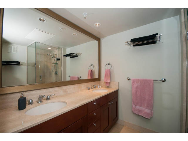 Furnished bathroom with double sink, large mirror, and pink towels. - 803 - 590 Nicola Street, Vancouver Downtown