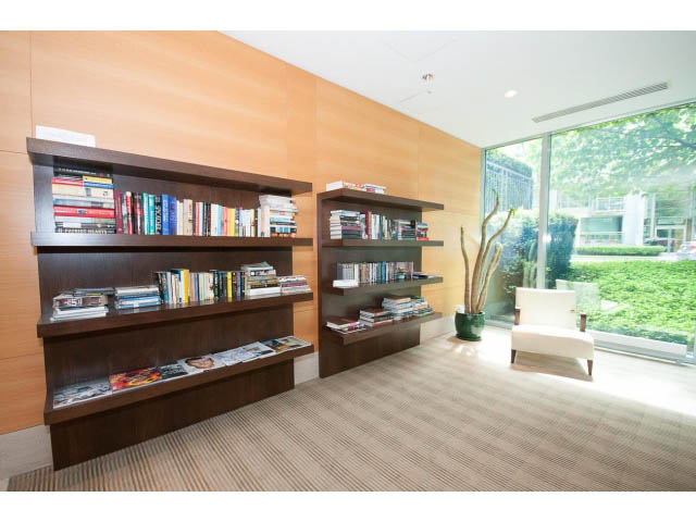 Furnished living room with built-in bookshelves and large window view. - 803 - 590 Nicola Street, Vancouver Downtown