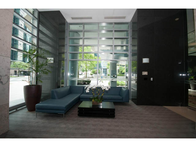 Furnished living room with large windows, city view, and modern furniture. - 803 - 590 Nicola Street, Vancouver Downtown