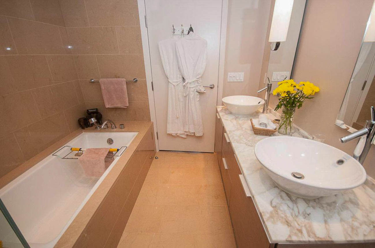 Furnished bathroom with marble countertops and a bathtub. - 2806 - 1111 Alberni Street, Vancouver Downtown