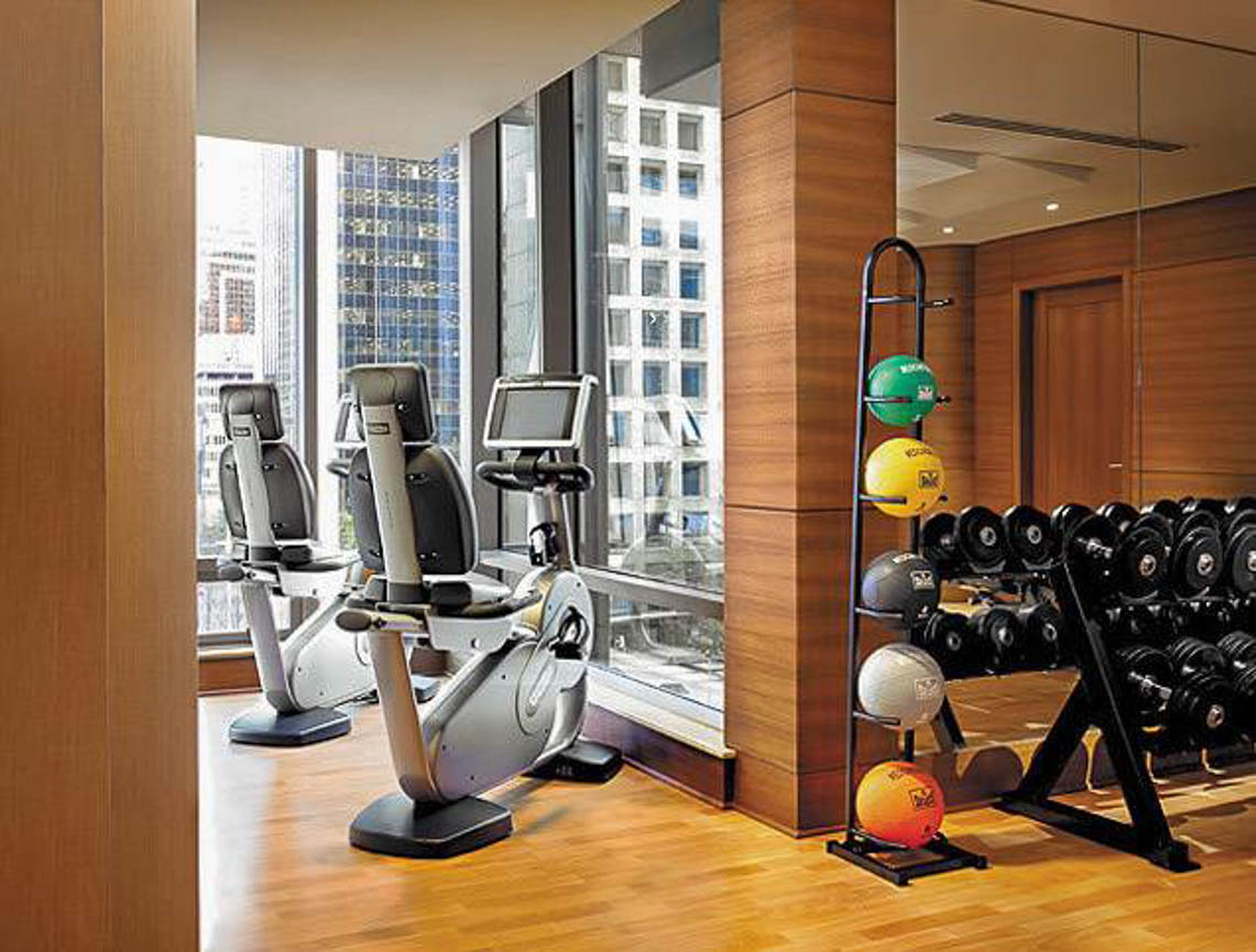 Bright and modern gym with city view, hardwood floors, and cardio equipment. - 2806 - 1111 Alberni Street, Vancouver Downtown