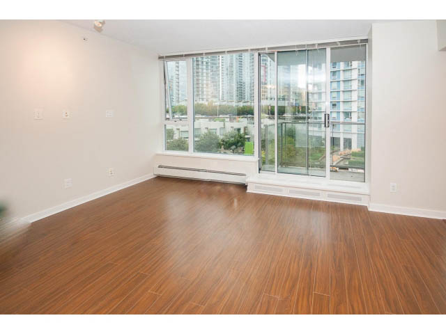 Bright living room with hardwood floors and city view. - 605 - 633 Abbott St, Vancouver Downtown