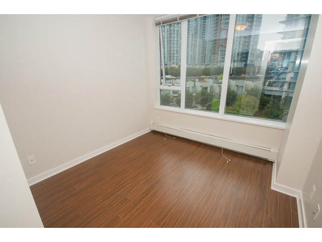 Bright living room with hardwood floors and city view. - 605 - 633 Abbott St, Vancouver Downtown