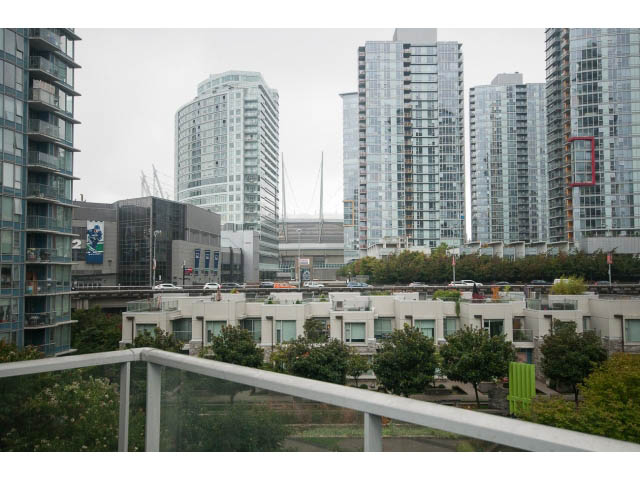 Bright living room with city view and modern furnishings. - 605 - 633 Abbott St, Vancouver Downtown