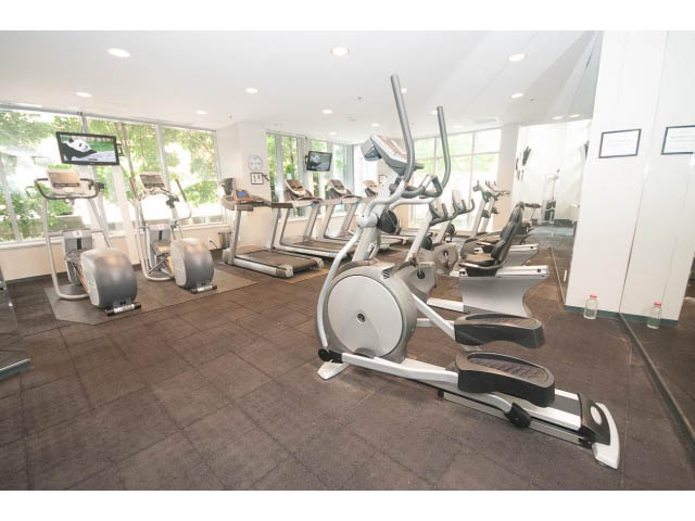 Bright and spacious gym with cardio machines and large windows. - 605 - 633 Abbott St, Vancouver Downtown