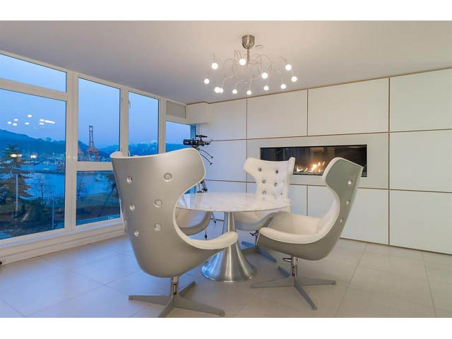 Bright dining room with modern white chairs and city view. - 708 - 27 Alexander St, Vancouver Downtown