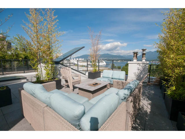 Furnished living room with city view and outdoor seating. - 708 - 27 Alexander St, Vancouver Downtown