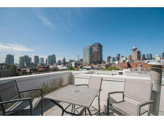 Furnished balcony with city view and outdoor seating. - 708 - 27 Alexander St, Vancouver Downtown