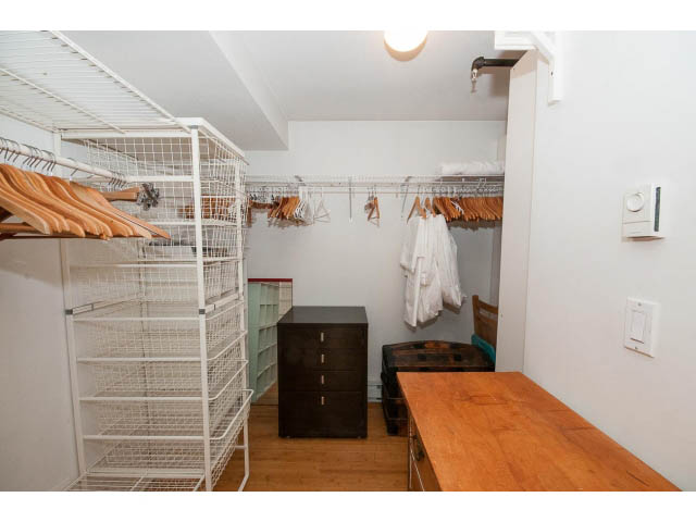 Furnished closet with wire shelving and wooden hangers, hardwood floors. - 716 - 428 West 8th Ave, Vancouver West Side