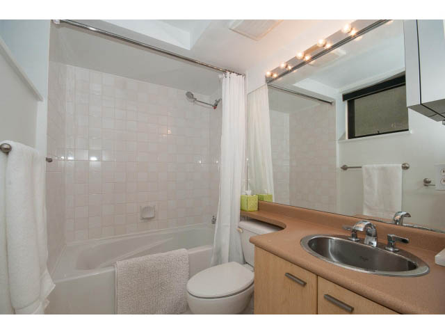 Bright bathroom with light wood cabinets and a modern sink. - 716 - 428 West 8th Ave, Vancouver West Side