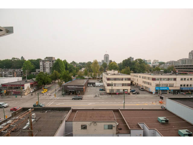 Loft with city view and rooftop access, featuring a modern urban landscape. - 716 - 428 West 8th Ave, Vancouver West Side