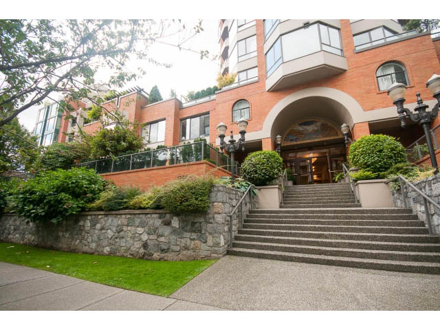 Furnished 3-bedroom condo with stone steps and arched entrance. - 103 - 1860 Robson Street, Vancouver Downtown