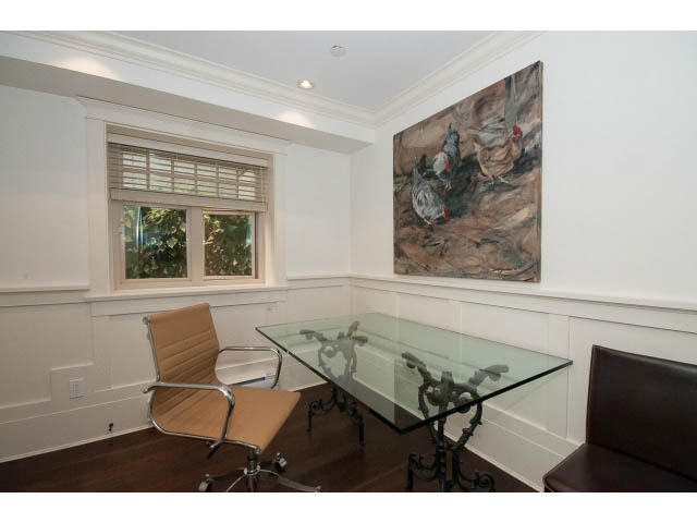 Furnished office with glass desk, hardwood floors, and artwork on the walls. - 1836 Greer Ave, Vancouver West Side