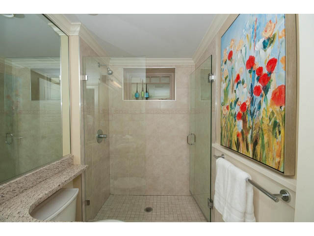 Spacious bathroom with granite countertops and colorful artwork. - 1836 Greer Ave, Vancouver West Side