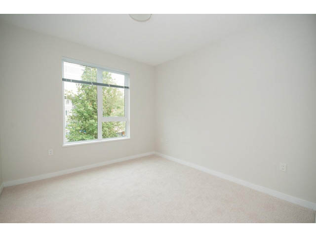 Bright den with carpeted floor and large window view. - 303 - 3825 Cate's Landing, North Vancouver