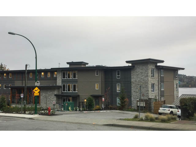 Furnished 2-bedroom + den condo with modern design, stone accents, and large windows. - 303 - 3825 Cate's Landing, North Vancouver