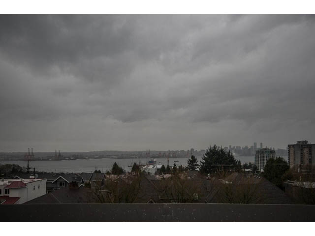 Furnished 3-bedroom townhouse with a stunning city view and overcast skies. - 5 - 244 5th E St, North Vancouver