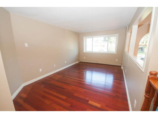 Bright living room with hardwood floors and large window. - 4135 Golf drive, North Vancouver