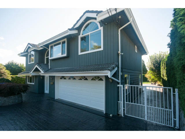 Furnished 5-bedroom + den house with dark siding and arched windows. - 4135 Golf drive, North Vancouver