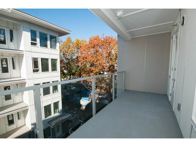 Spacious balcony with city view and autumn foliage. - 414 - 255 West 1st St, North Vancouver