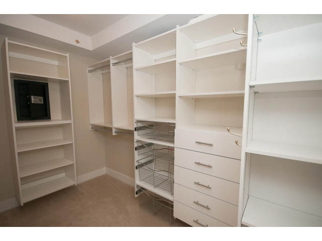 Spacious walk-in closet with white shelving and drawers. - 708 - 4685 Valley Dr, Vancouver West Side