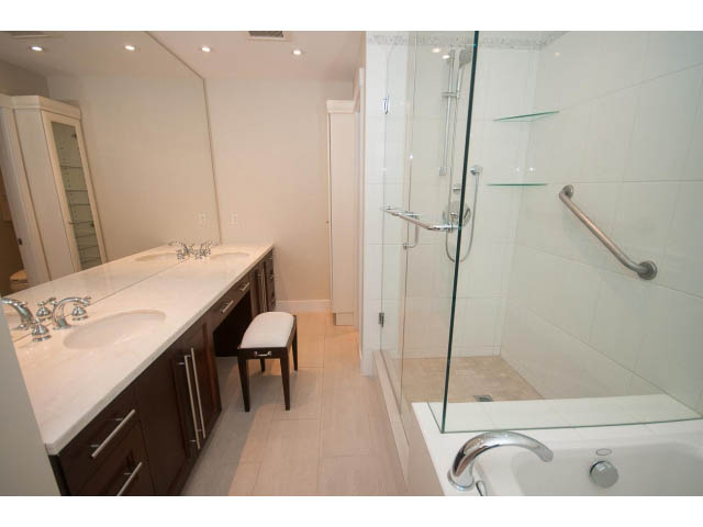 Spacious bathroom with marble countertops, glass shower, and modern fixtures. - 708 - 4685 Valley Dr, Vancouver West Side