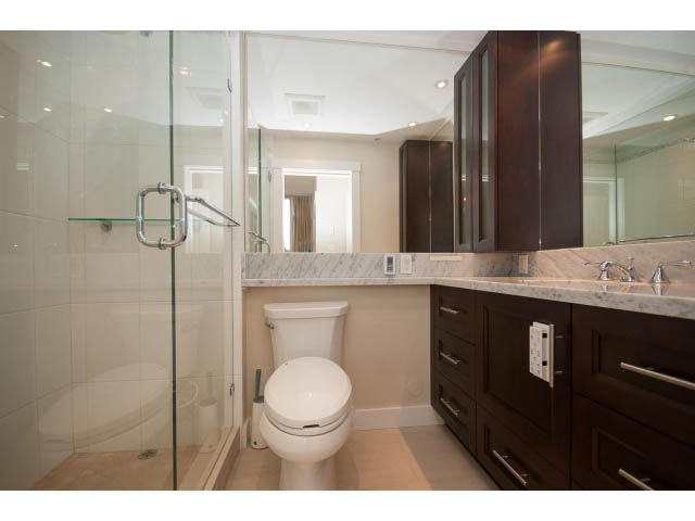Spacious bathroom with marble countertops and dark wood cabinetry. - 708 - 4685 Valley Dr, Vancouver West Side