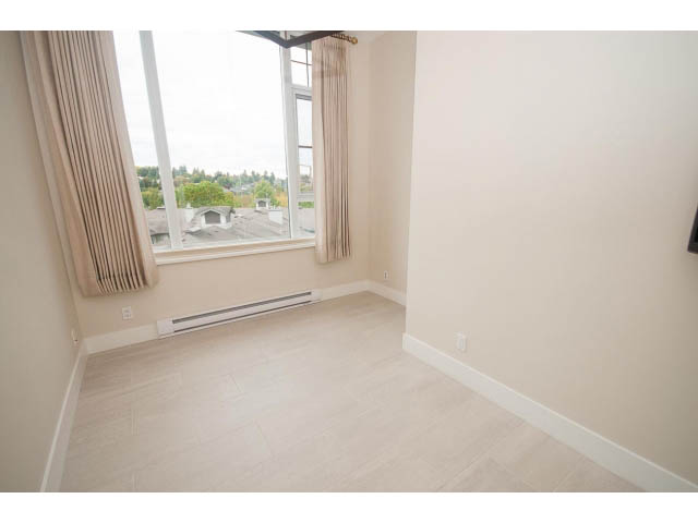 Bright living room with hardwood floors and city view. - 708 - 4685 Valley Dr, Vancouver West Side