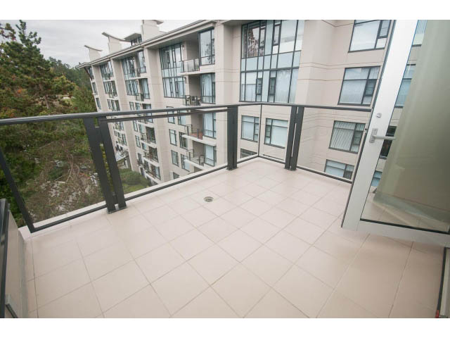 Spacious penthouse balcony with tiled flooring and modern railings. - 708 - 4685 Valley Dr, Vancouver West Side