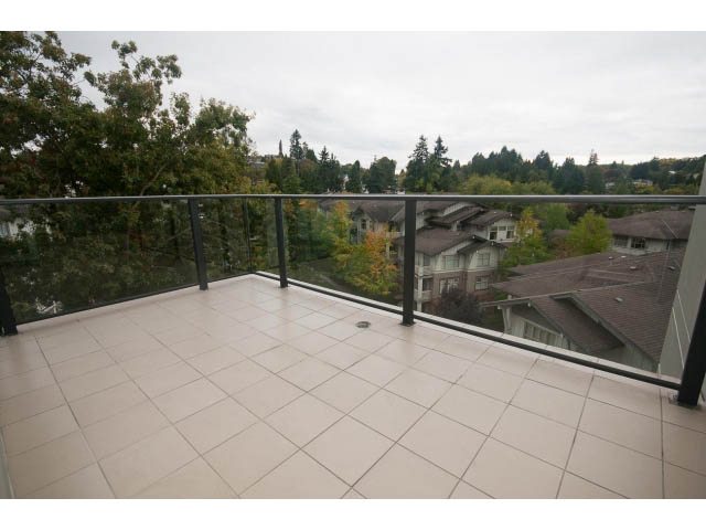 Furnished penthouse balcony with tiled flooring and city view. - 708 - 4685 Valley Dr, Vancouver West Side