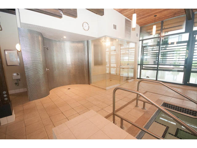 Spacious penthouse with modern bathroom featuring a large walk-in shower and glass-enclosed tub. - 708 - 4685 Valley Dr, Vancouver West Side