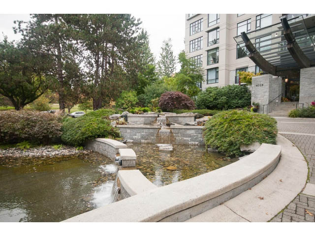 Penthouse patio with water feature and lush greenery. - 708 - 4685 Valley Dr, Vancouver West Side