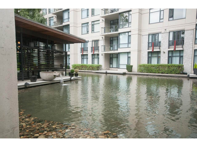 Penthouse living room with water feature and modern balcony. - 708 - 4685 Valley Dr, Vancouver West Side