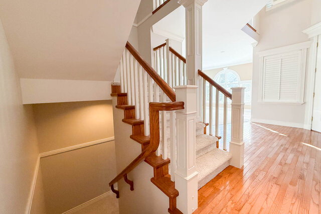 Staircase down to the lower level beside the foyer. - 3858 Sauve Place, North Vancouver
