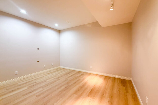Lower-level office with hardwood floors, pot lights and track lighting. - 3858 Sauve Place, North Vancouver