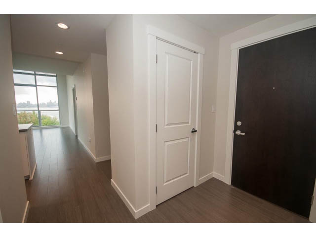 Bright kitchen with hardwood floors and city view. - 524 - 255 West 1st St, North Vancouver