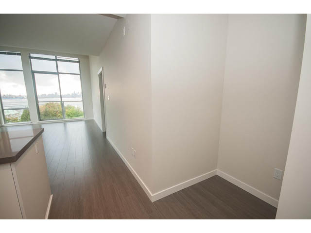 Bright kitchen with hardwood floors and city view. - 524 - 255 West 1st St, North Vancouver