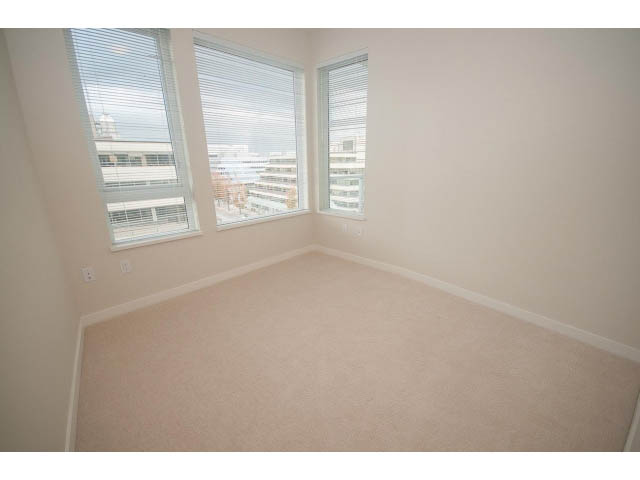 Spacious penthouse bedroom with large windows and city view. - 524 - 255 West 1st St, North Vancouver