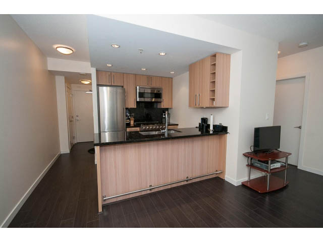 Furnished 1-bedroom condo with hardwood floors and a modern kitchen with stainless steel appliances. - 802 - 1708 Columbia St, Vancouver West Side